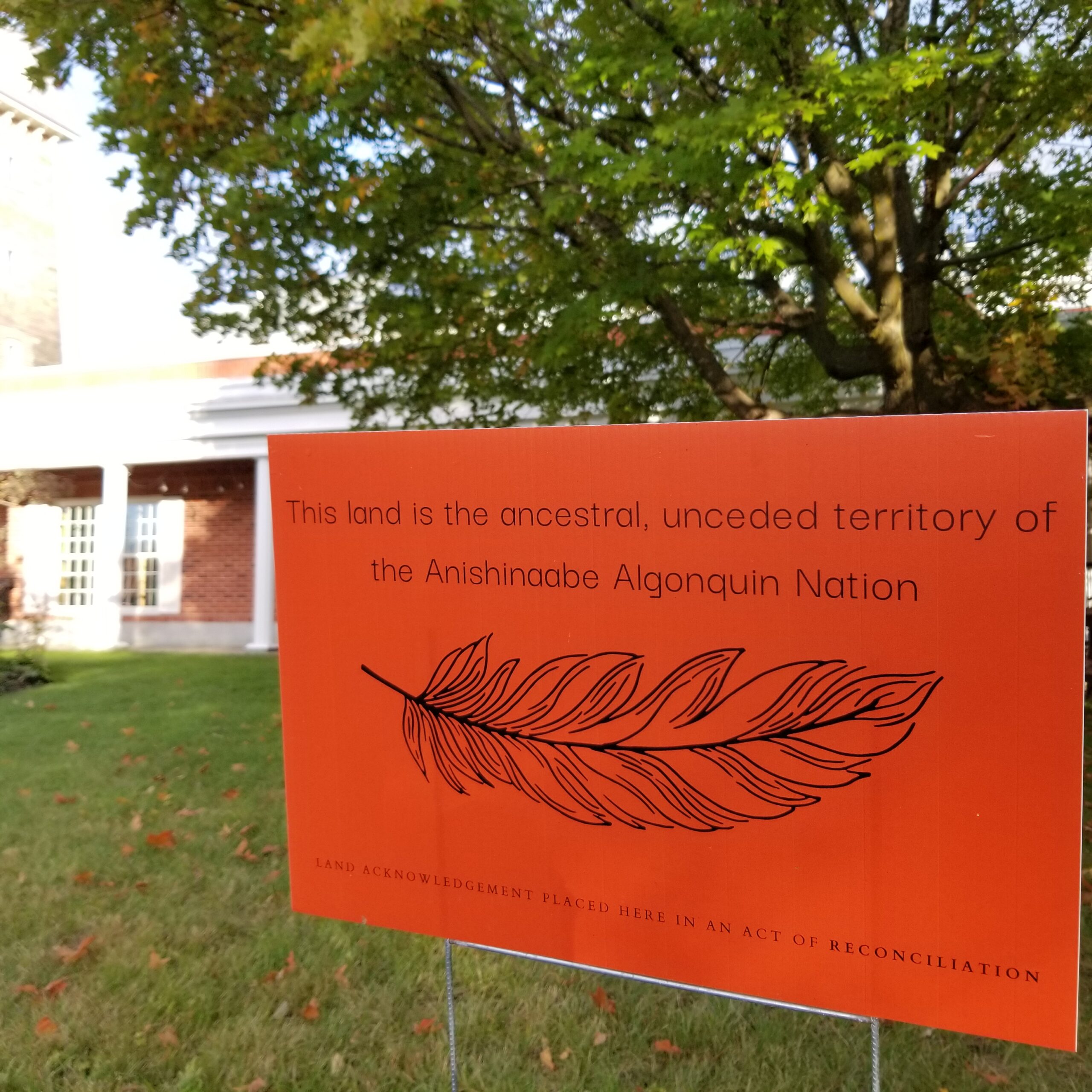 Sign reading This land is the ancestral, unceded territory of the Anishinaabe Algonquin Nation