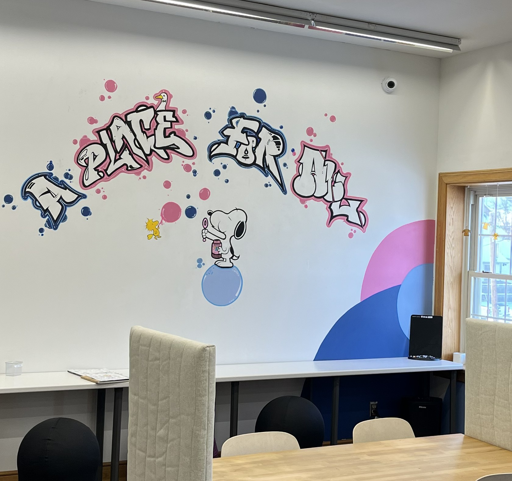 Coral, Community Navigator from the Table Community Food Center, stands in the Perth & District Library